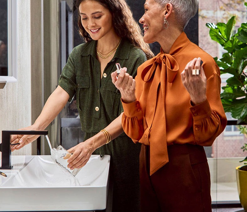 Grandmother and daughter prepare for the day at a sink and faucet made by Hansgrohe